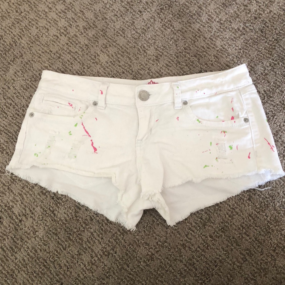 White paint splattered jean shorts